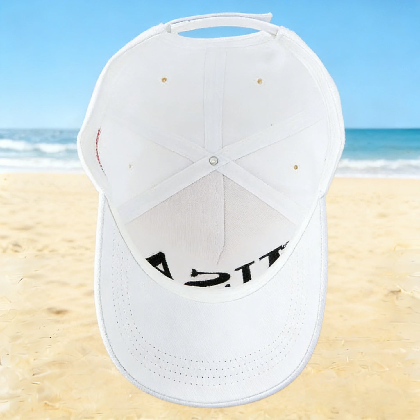 A fashionable white American hat with "45-47" details, perfect for a beach outing, ideal for a leisurely walk by the seaside or
